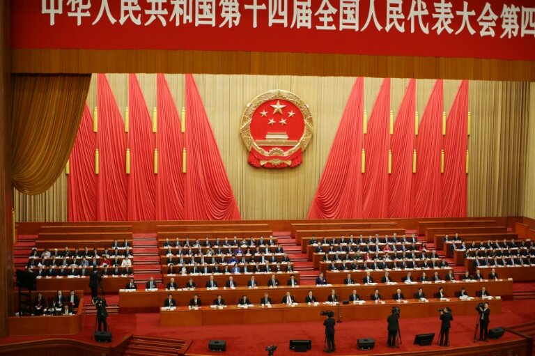 Des délégués assistent à la séance de clôture de l'Assemblée nationale populaire (ANP) au Palais du Peuple à Pékin le 12 mars 2026 © ANDRES MARTINEZ CASARES