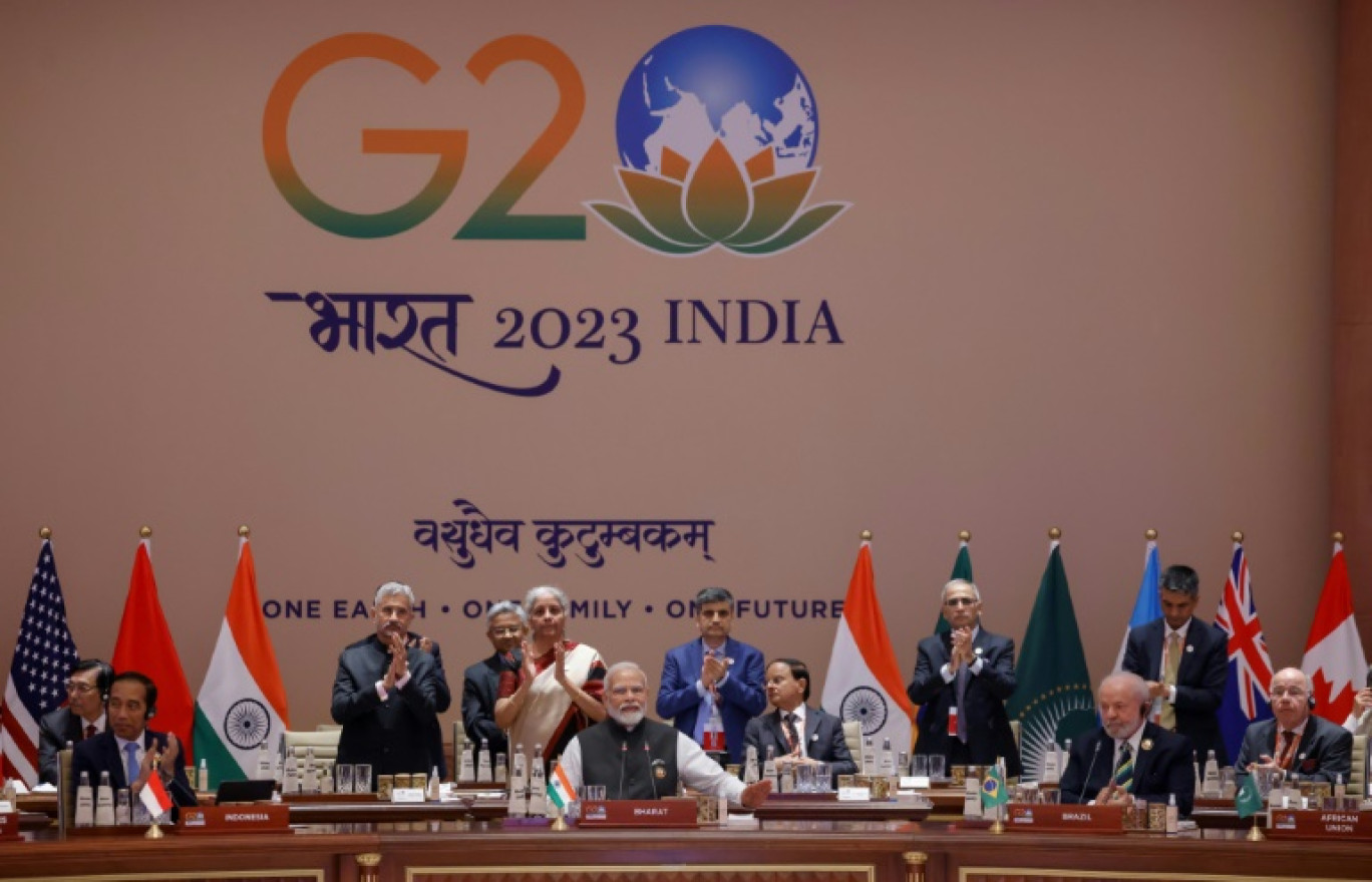 Le Premier ministre indien Narendra Modi (c) lors de l'ouverture de la deuxième session de travail des dirigeants du G20, le 9 septembre 2023 à New Delhi © Ludovic MARIN