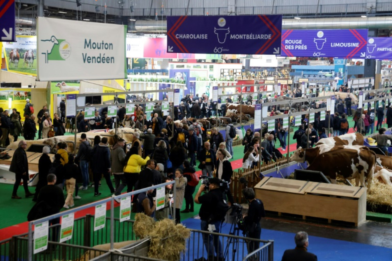 Des exposants au 60ème Salon de l'Agriculture, le 26 février 2024 à Paris © Ludovic MARIN