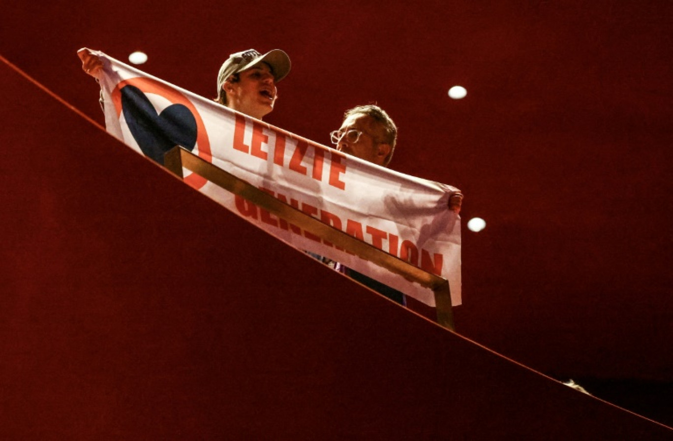 Un militant la "Letzte Generation" (dernière génération), important mouvement activiste en Allemagne, auteur de nombreuses actions spectaculaires au nom de la défense du climat, lors du congrès des cathloiques allemands à à Erfurt, dans l'est de l'Allemagne, le 31 mai 2024 © Kai Pfaffenbach