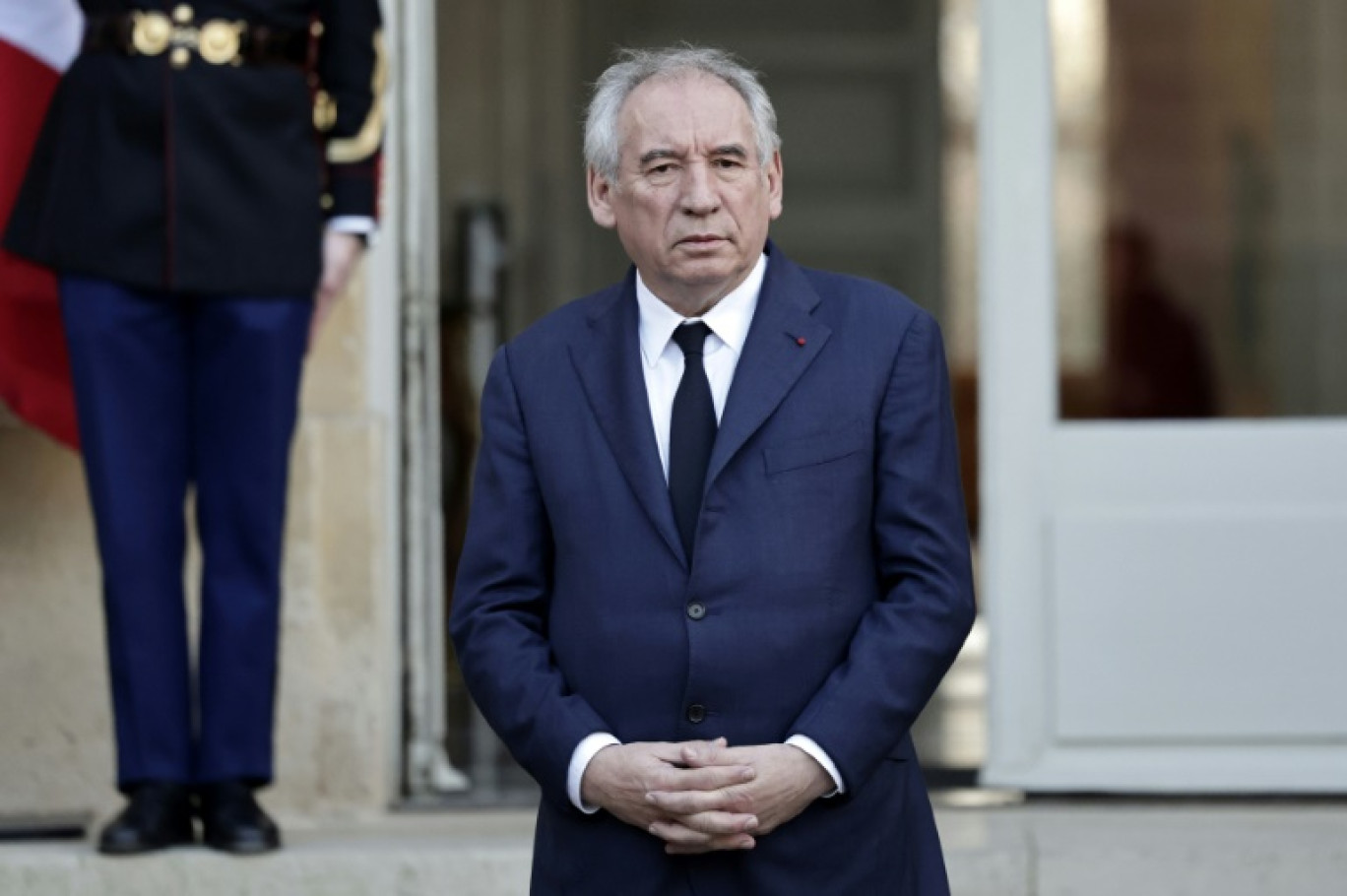 Le Premier ministre François Bayrou (c-g) lors d'une réunion avec les partenaires sociaux au ministère du Travail, le 17 janvier 2025 à Paris © Bertrand GUAY