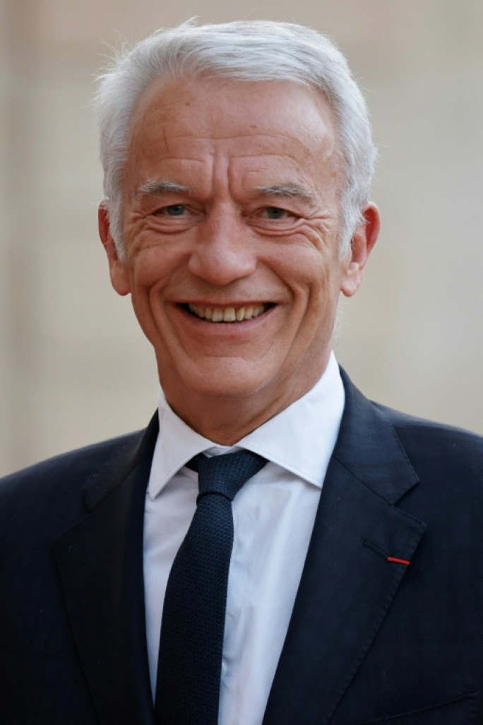 Le dirigeant du Medef, Patrick Martin (d), au côté d'un responsable de la CFDT, Yvan Ricordeau, à Paris, le 22 novembre 2024 © Thomas SAMSON