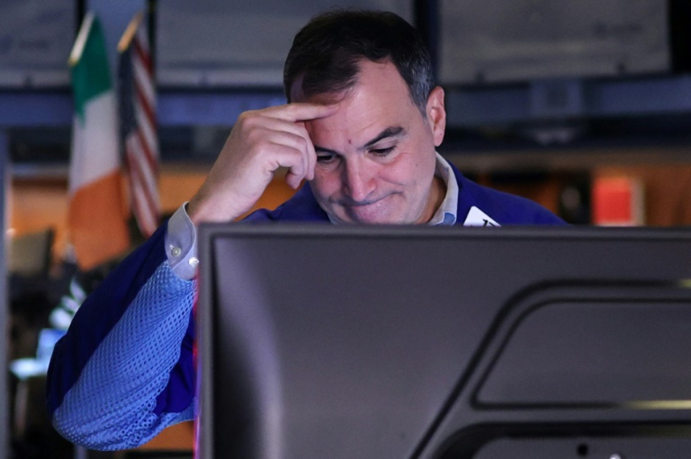 Trader sur le New York Stock Exchange (NYSE), à l'ouverture de Wall Street le 11 avril 2025. © TIMOTHY A. CLARY