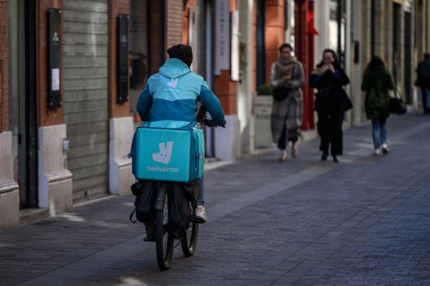 Un livreur à Toulouse le 18 mars 2025 © Ed JONES