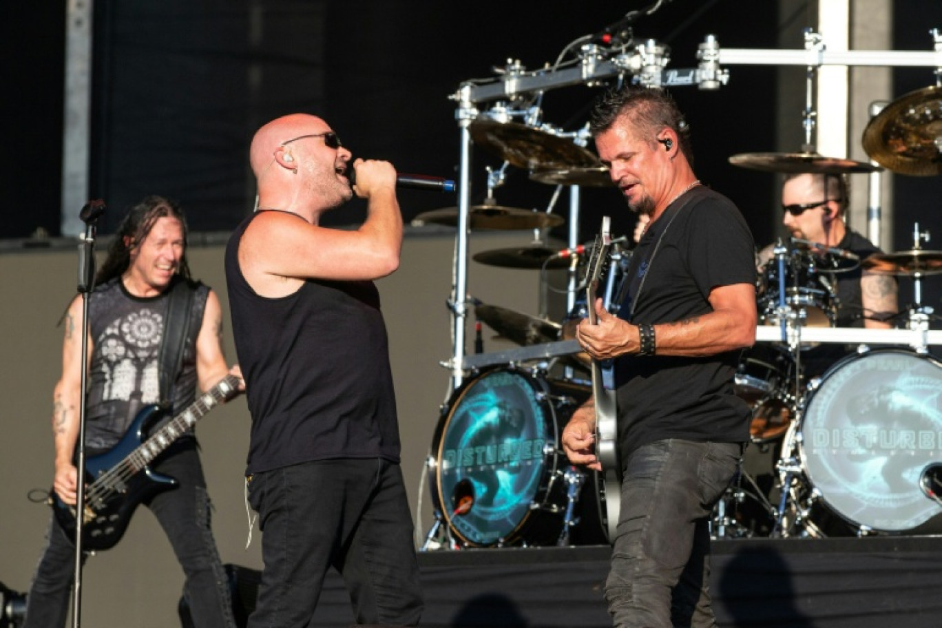 (g-d) John Moyer, David Draiman, Dan Donegan et Mike Wengren du groupe Disturbed en concert à Austin, le 13 octobre 2018 au Texas © SUZANNE CORDEIRO