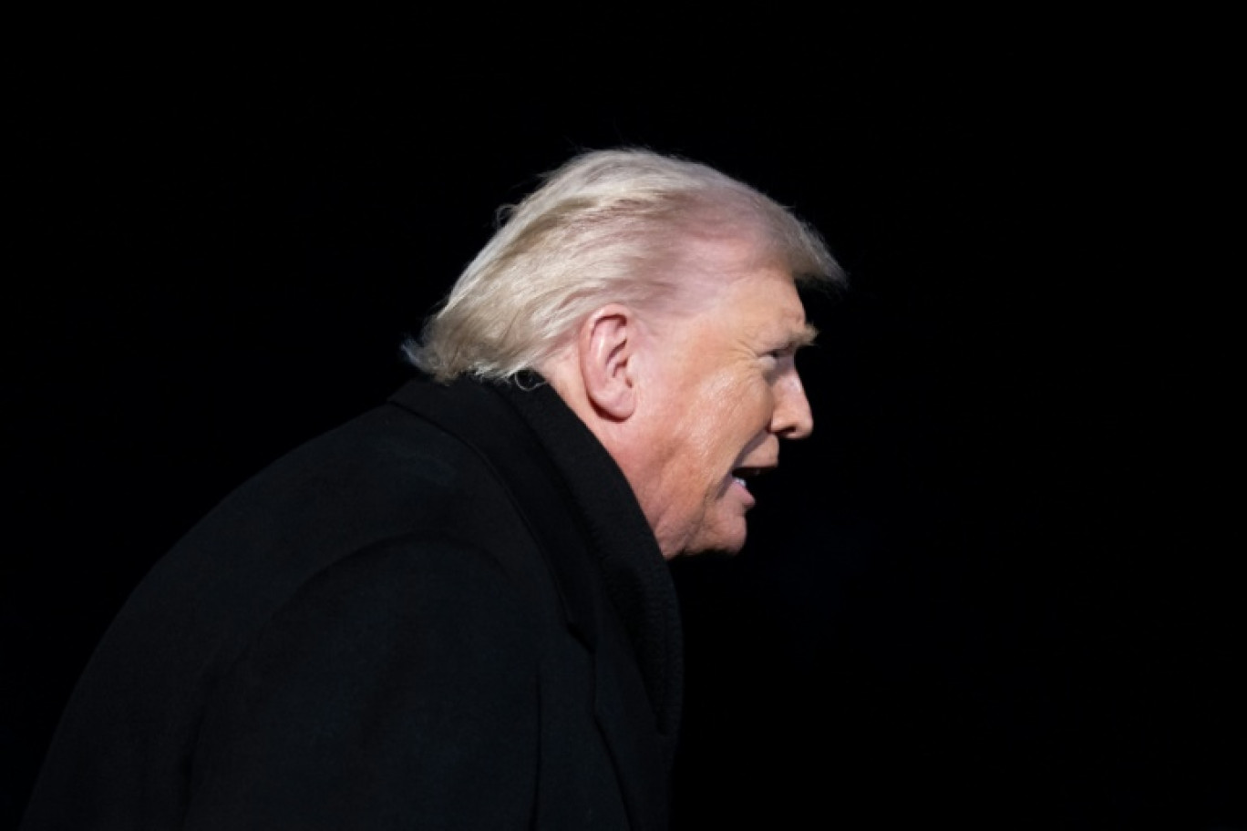 Donald Trump peu avant d'embarquer pour Davos mardi soir à Washington, le 20 janvier 2026. © SAUL LOEB