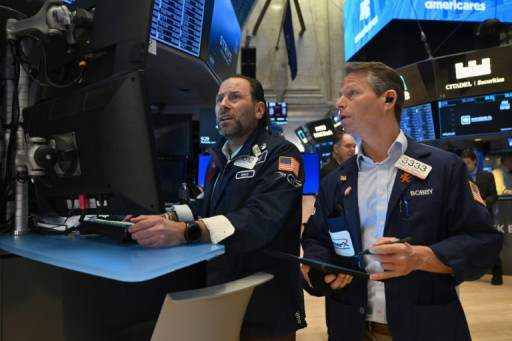 Wall Street termine en hausse, encouragée par la Fed